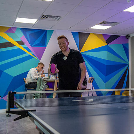 The Ascensor team playing table tennis